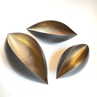 3 cups in folded hammered brass and black lacquered on the outside. In the style of Serge Mouille.