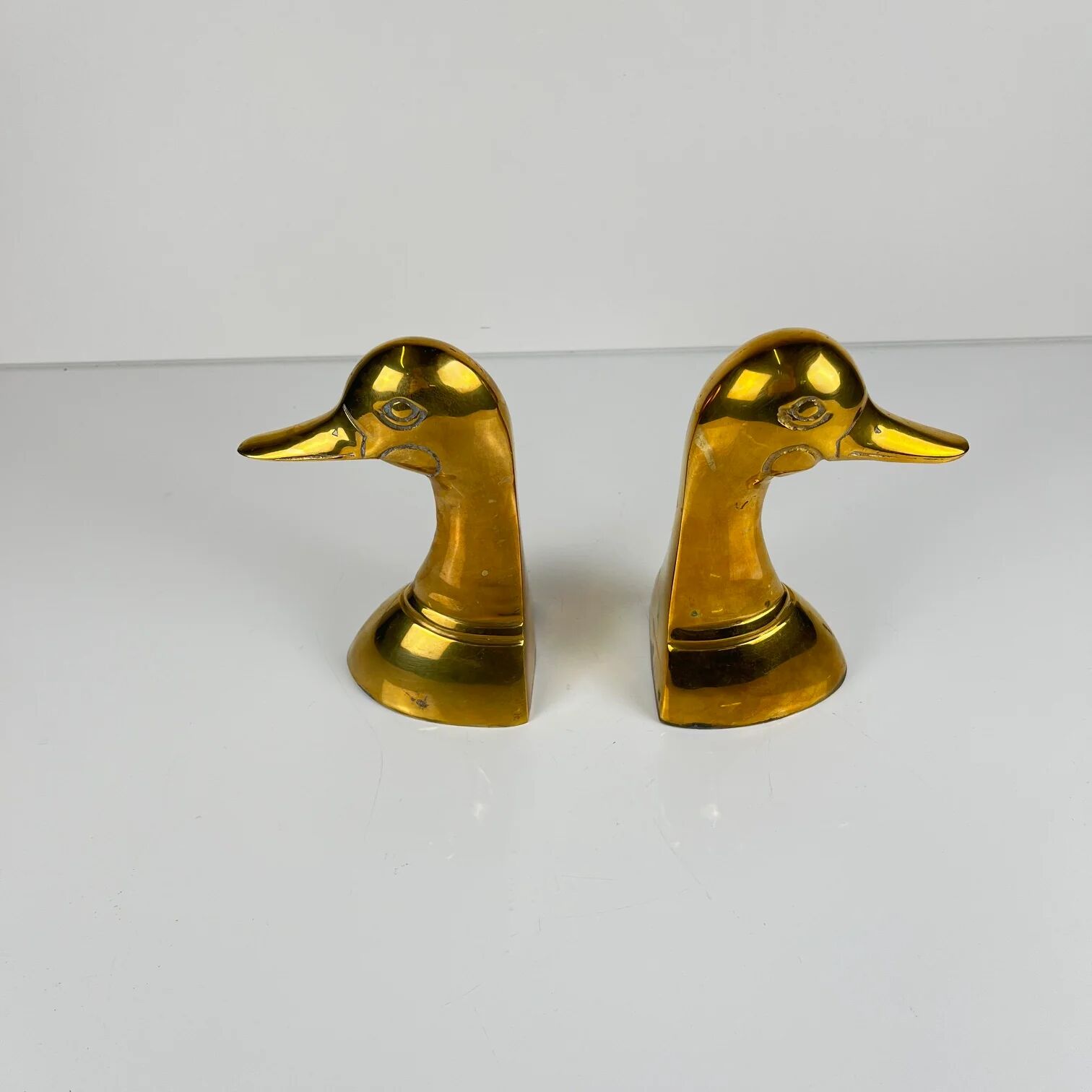Pair of brass bookends in the shape of a duck's head, 1970.