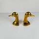 Pair of brass bookends in the shape of a duck's head, 1970.