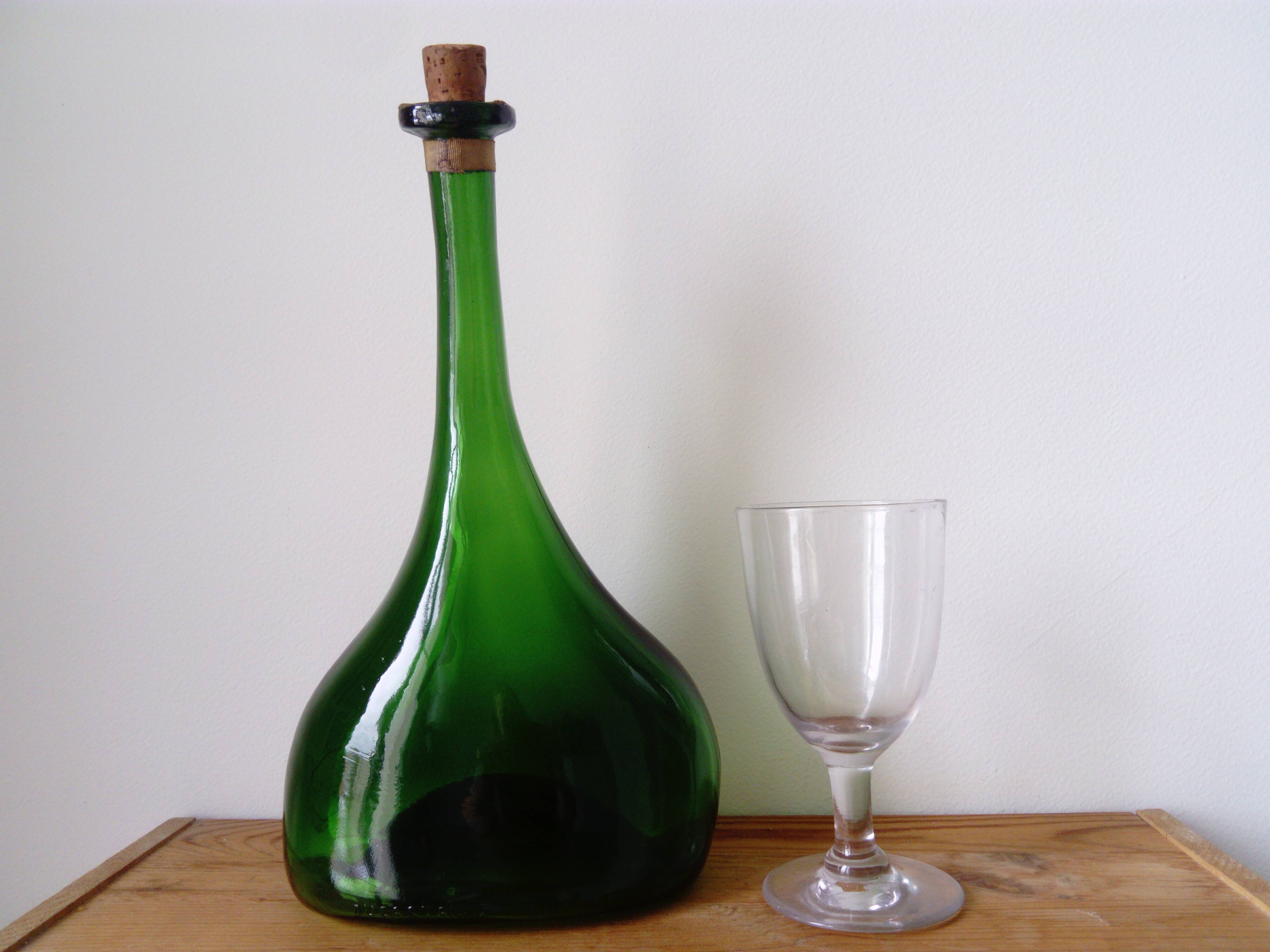 Old blown glass bottle, free form. Armagnac