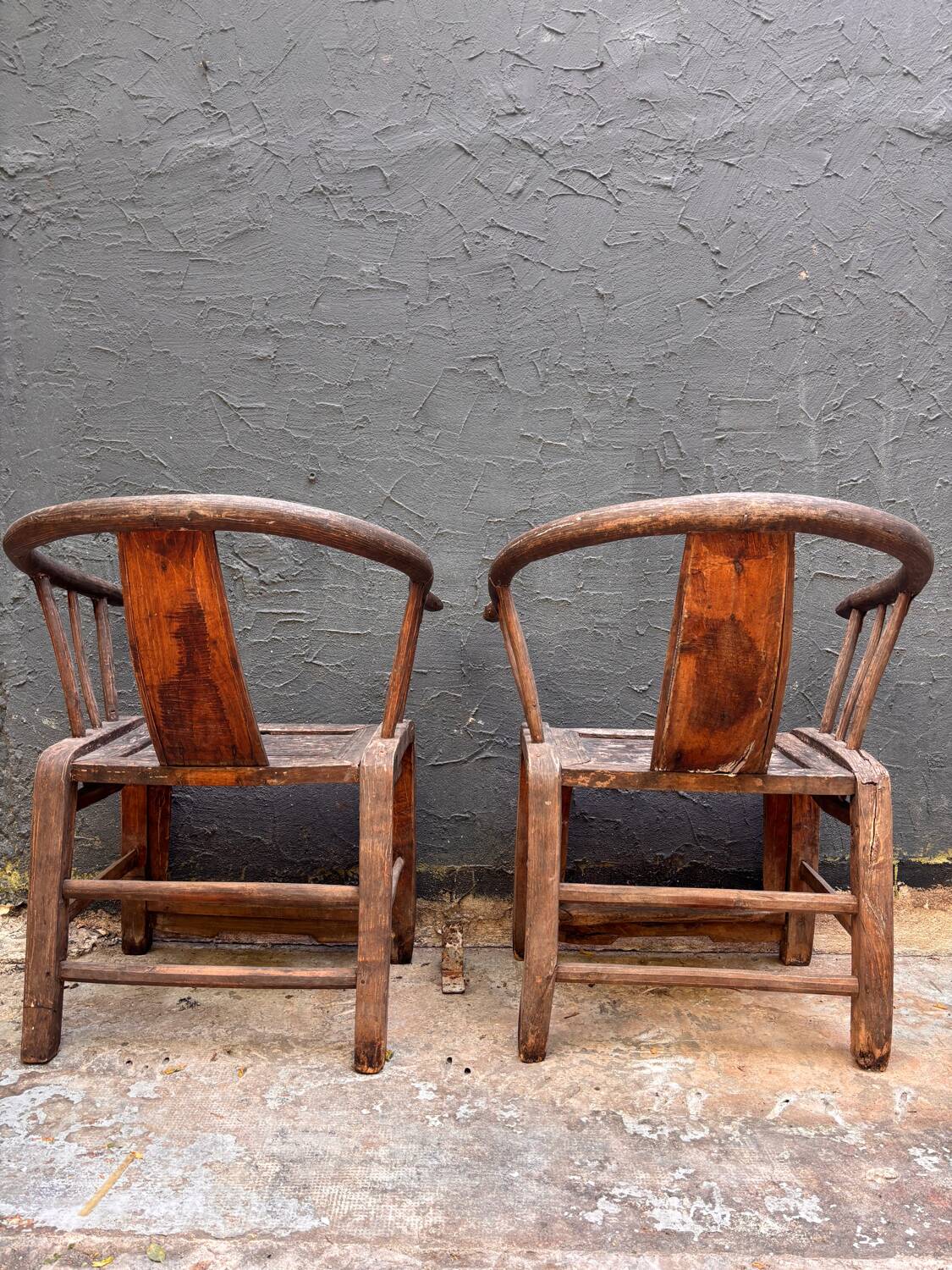 Pair of antique Chinese armchairs in patinated wood