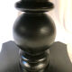 Table circulaire en bois noirci, pied central balustre