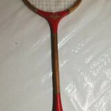 Red ribbon wooden badminton racket