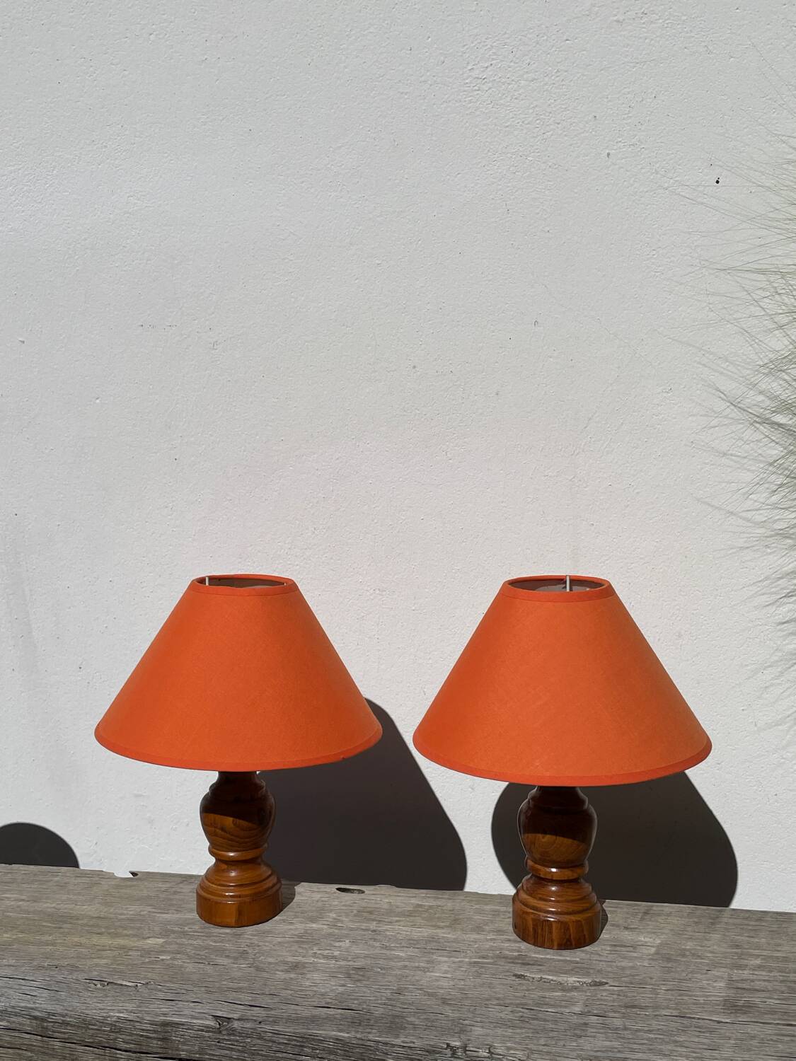 Pair of orange turned wood lamps