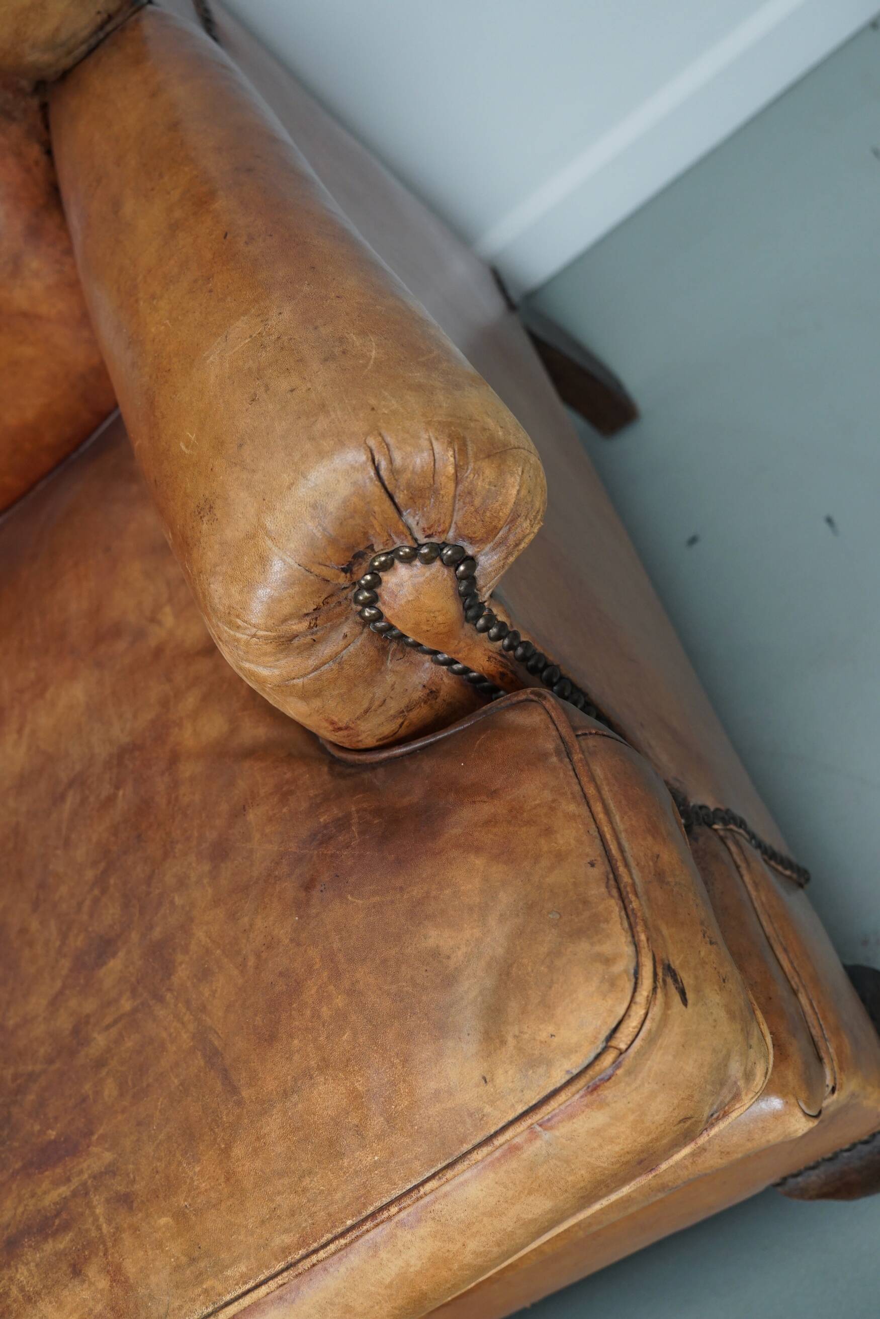 Vintage Dutch cognac coloured leather club chair, with footstool