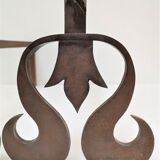Pair of sculptural cast iron chenets with twisted heads