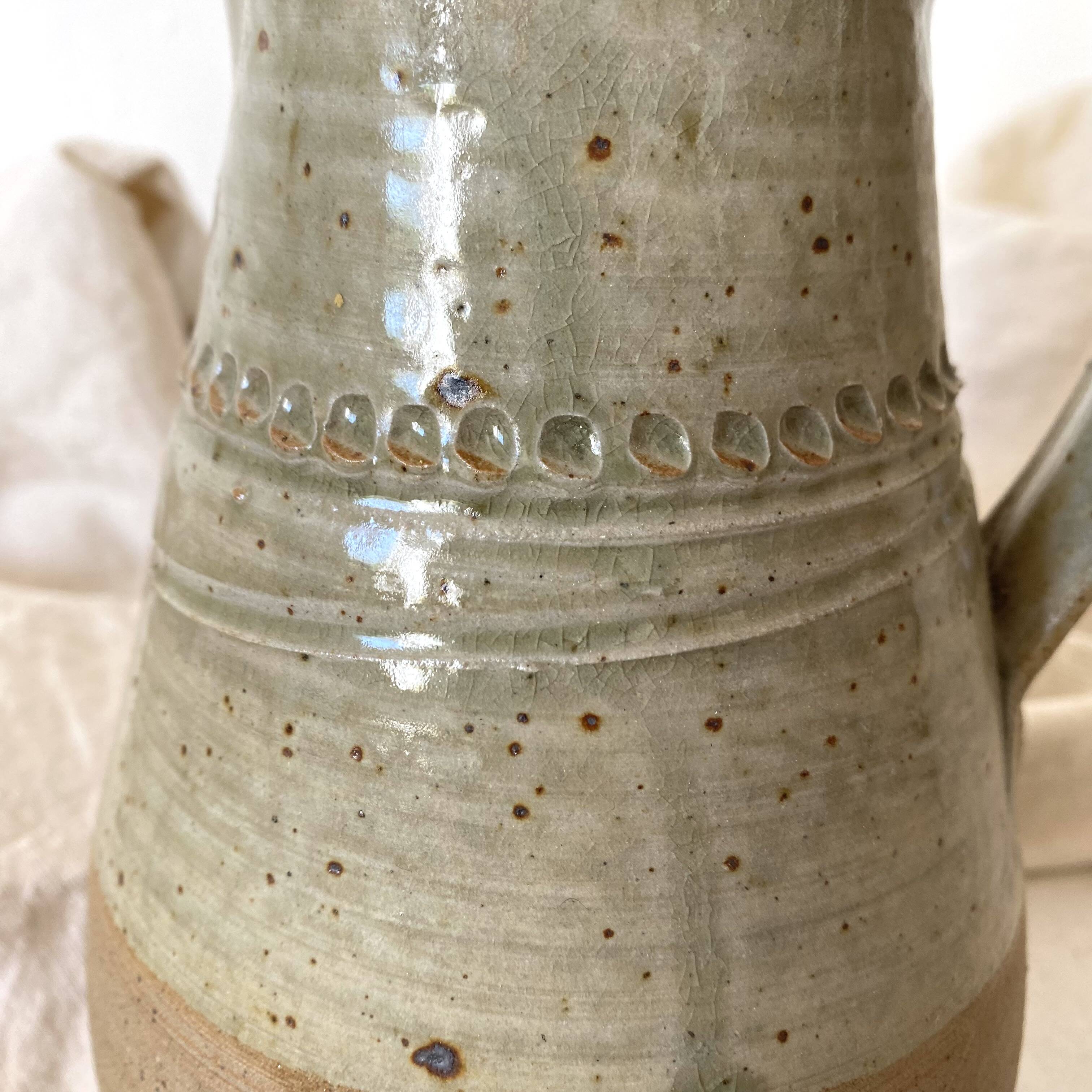Vintage handcrafted terracotta pitcher