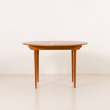 Scandinavian round teak table with hidden extension, 1970s