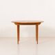 Scandinavian round teak table with hidden extension, 1970s