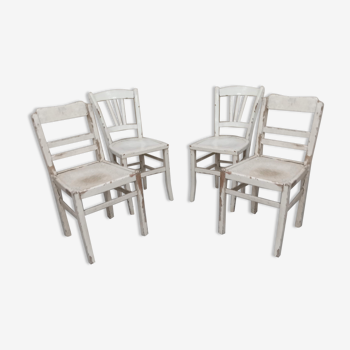 4 patinated white bistro chairs