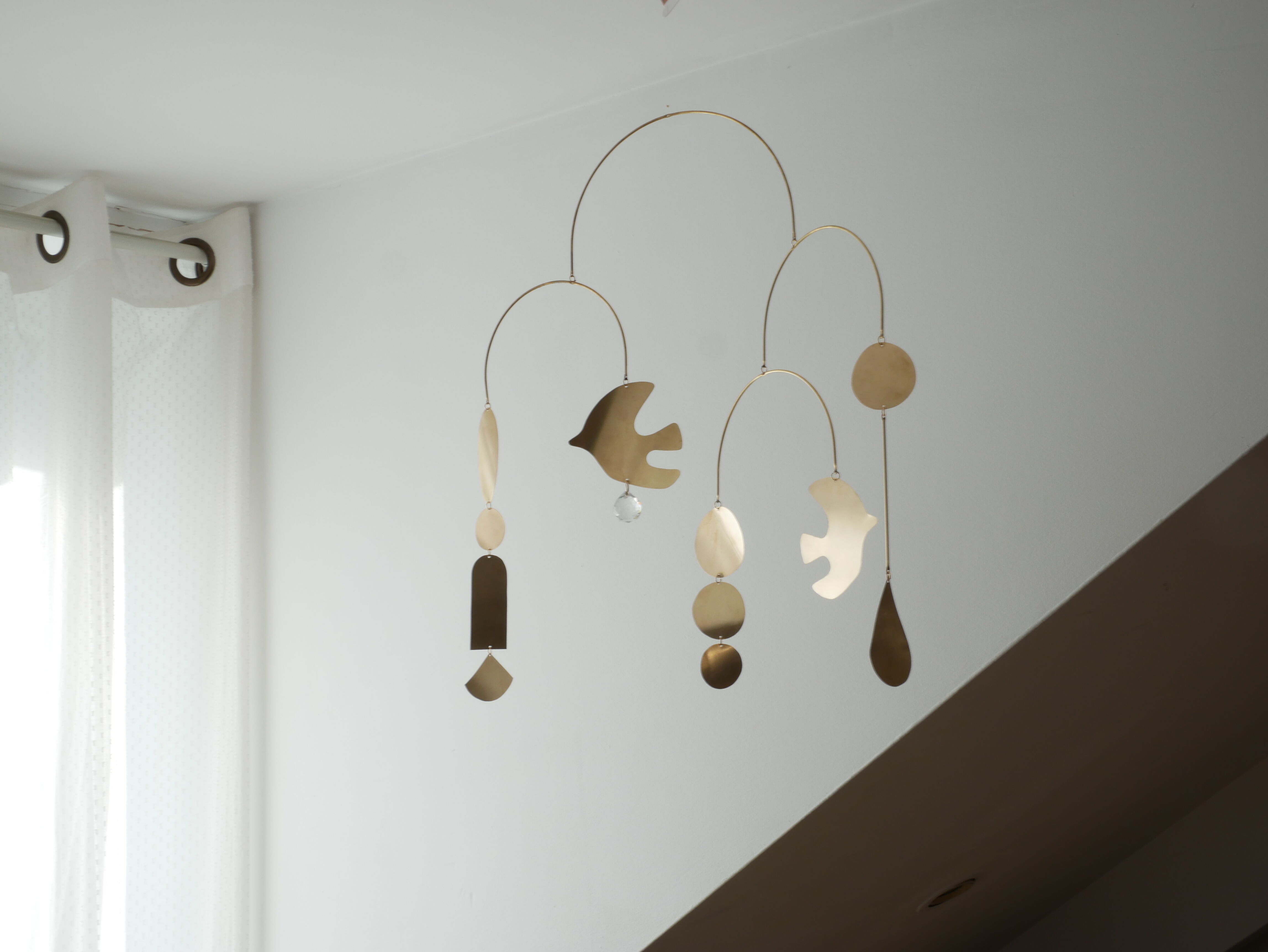 Mobile model Rana . Mobile in abstract brass.