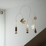 Mobile model Rana . Mobile in abstract brass.