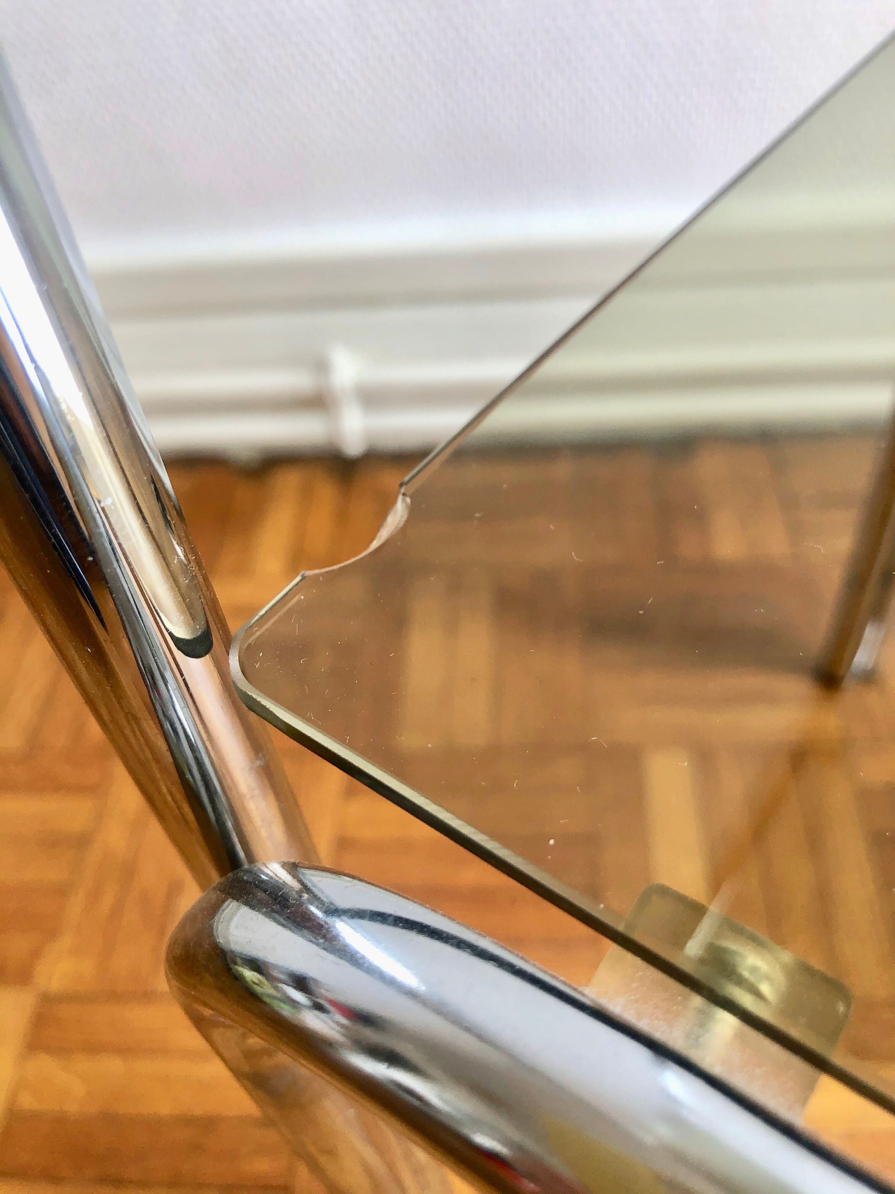 Two-tray console in glass and chrome metal