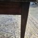 Rustic farmhouse coffee table from the 1900s with two drawers.