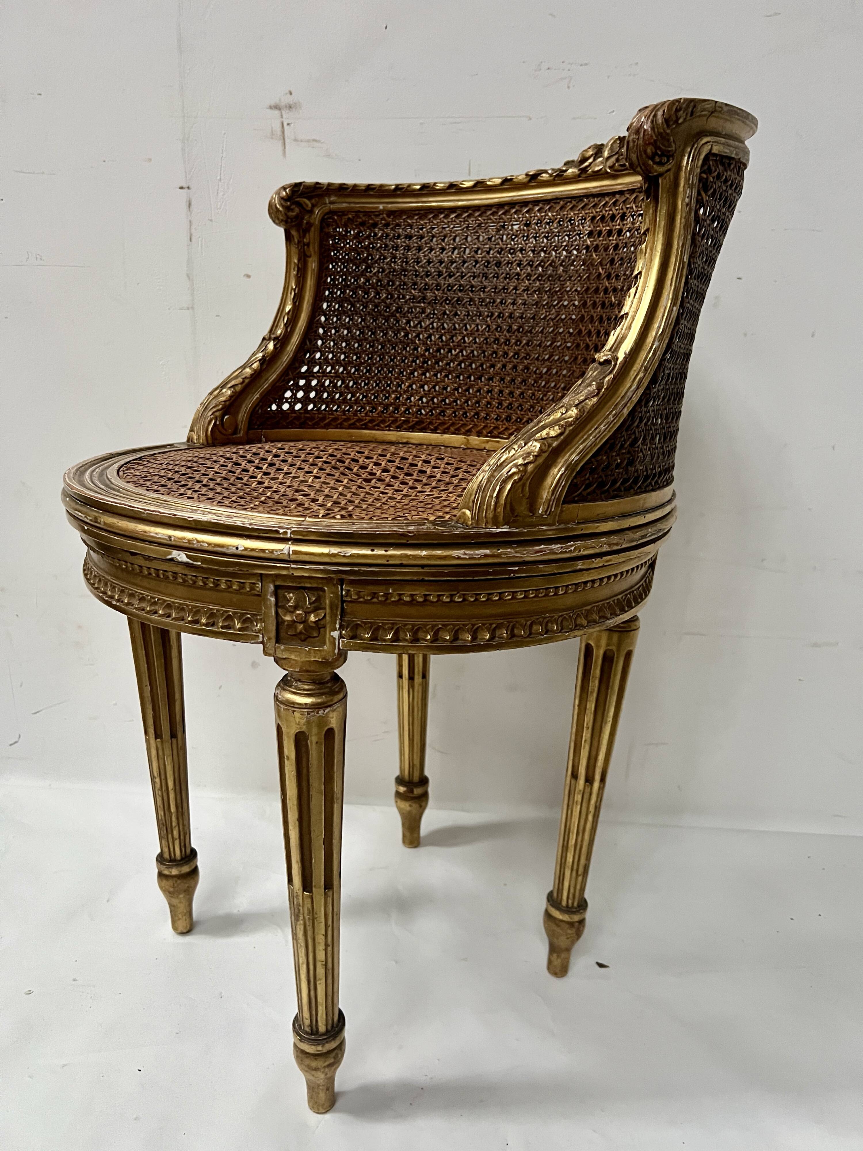 Louis XVI style armchair in wood and gilded stucco, 20th century.