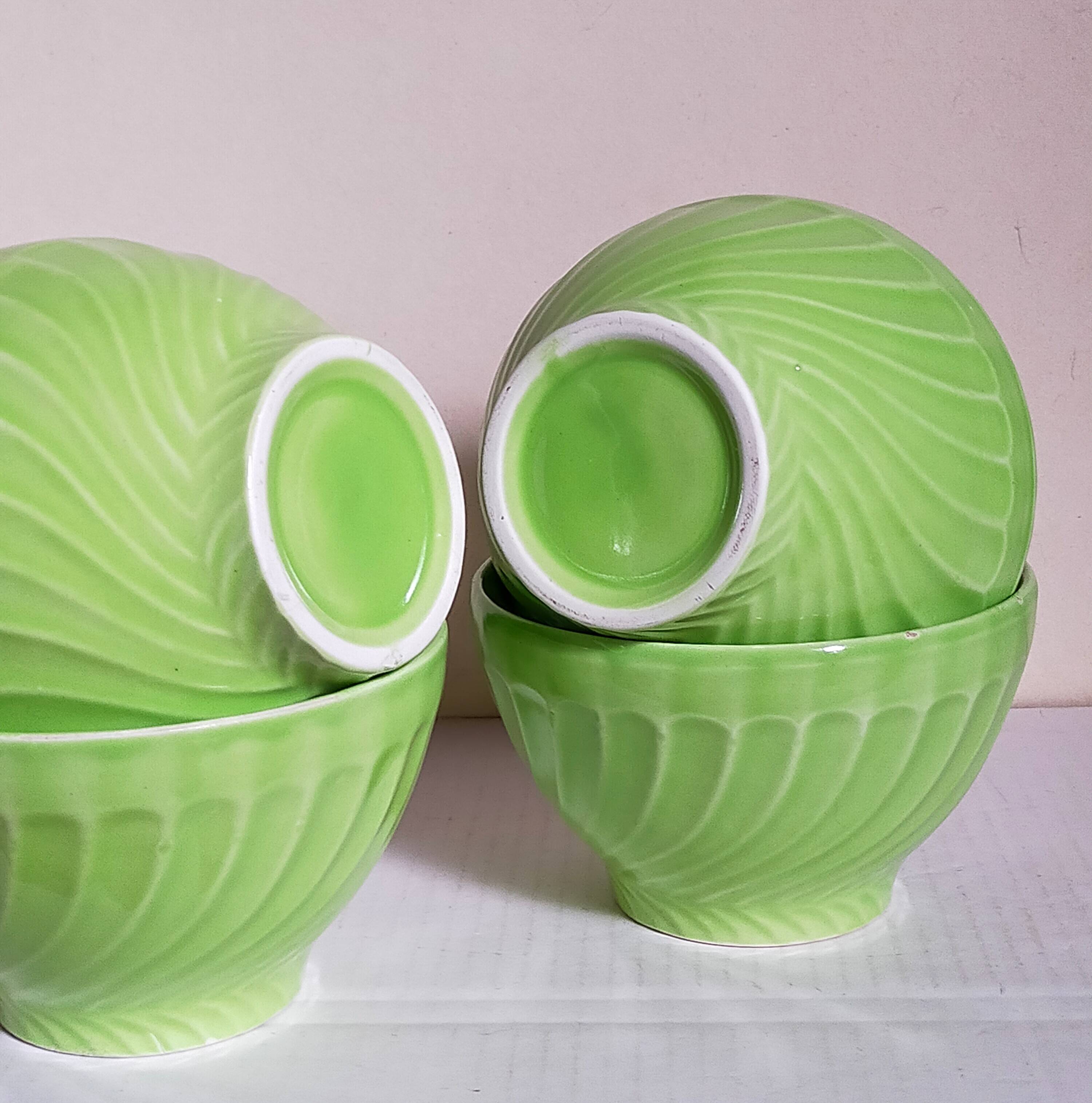Four vintage spring green earthenware bowls