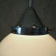Art Deco suspension globe in white opaline with an aluminium stem.