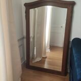Hazed and carved wooden mirror