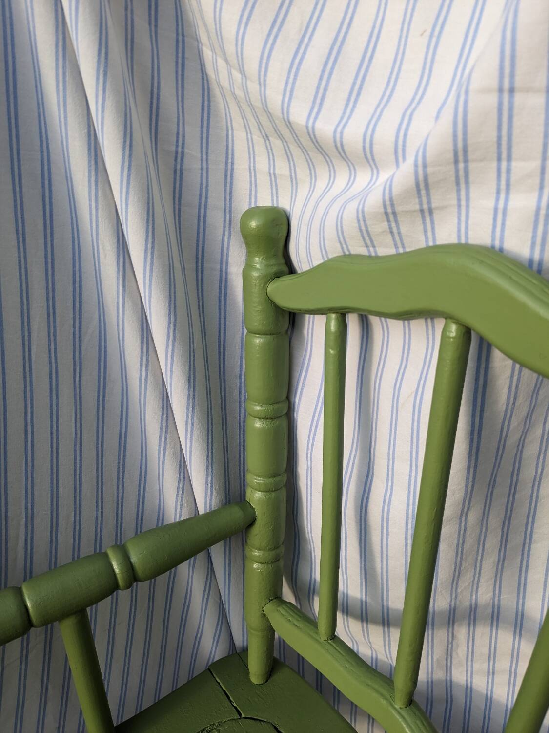 Green children's chair in turned wood