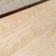 Coffee table in brass and travertine.