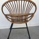 Fauteuil coquille en rotin - piétement tubulaire métallique noir - 1960