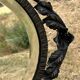 Bevelled oval mirror, richly crafted Art Deco wrought iron.