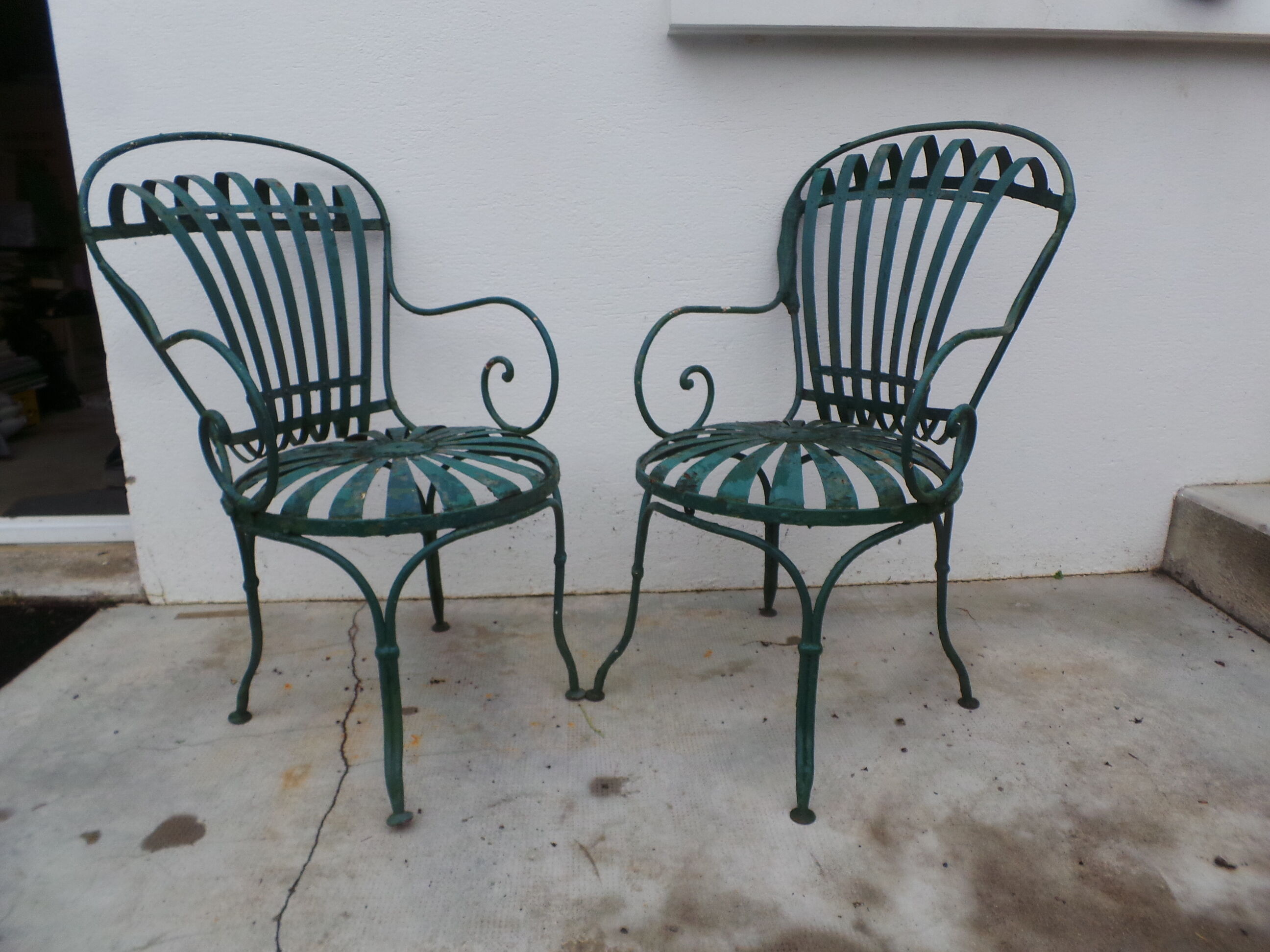 Pair of wrought iron garden chairs by François Carre