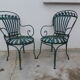 Pair of wrought iron garden chairs by François Carre