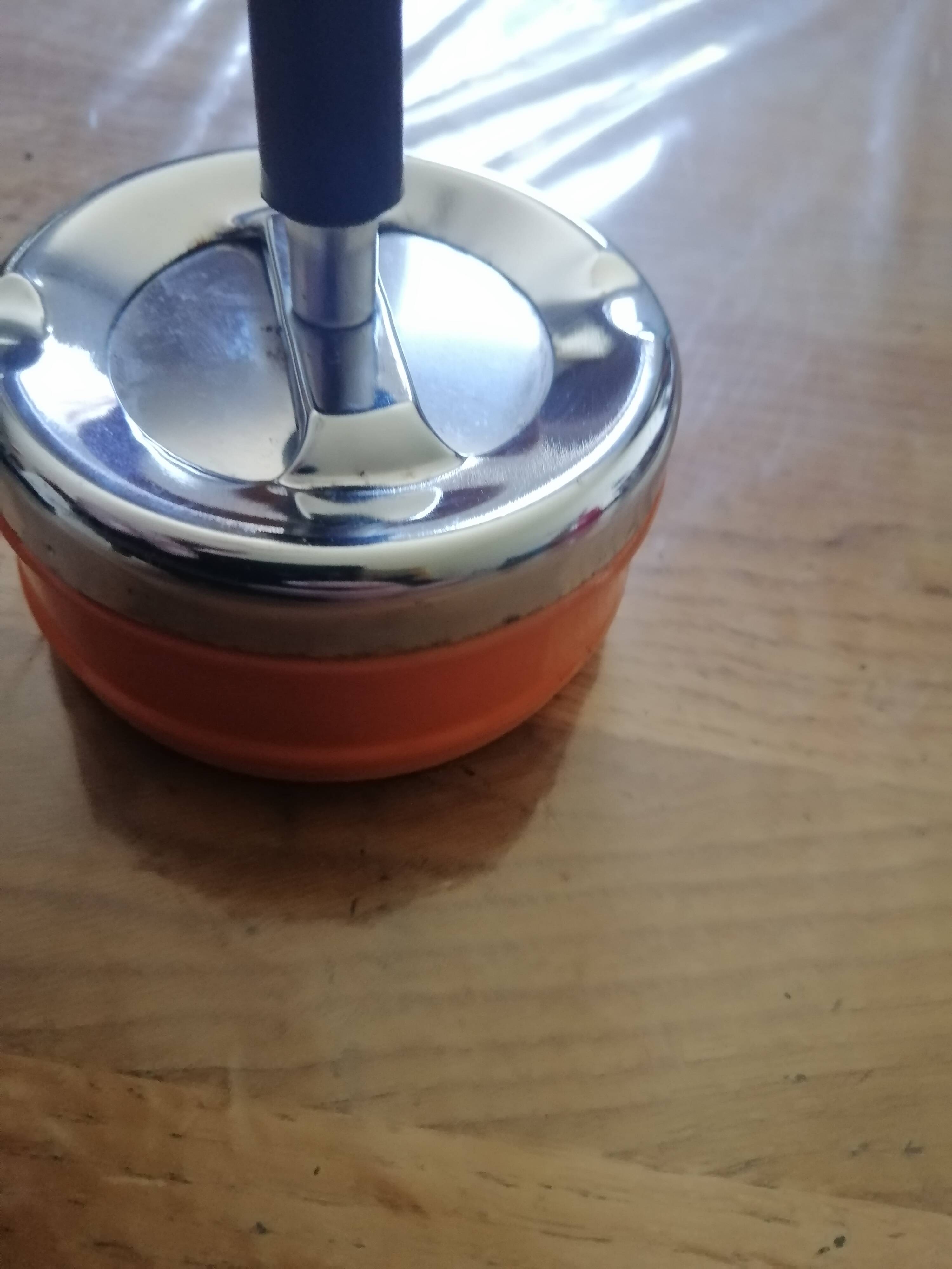 Vintage orange rotating ashtray