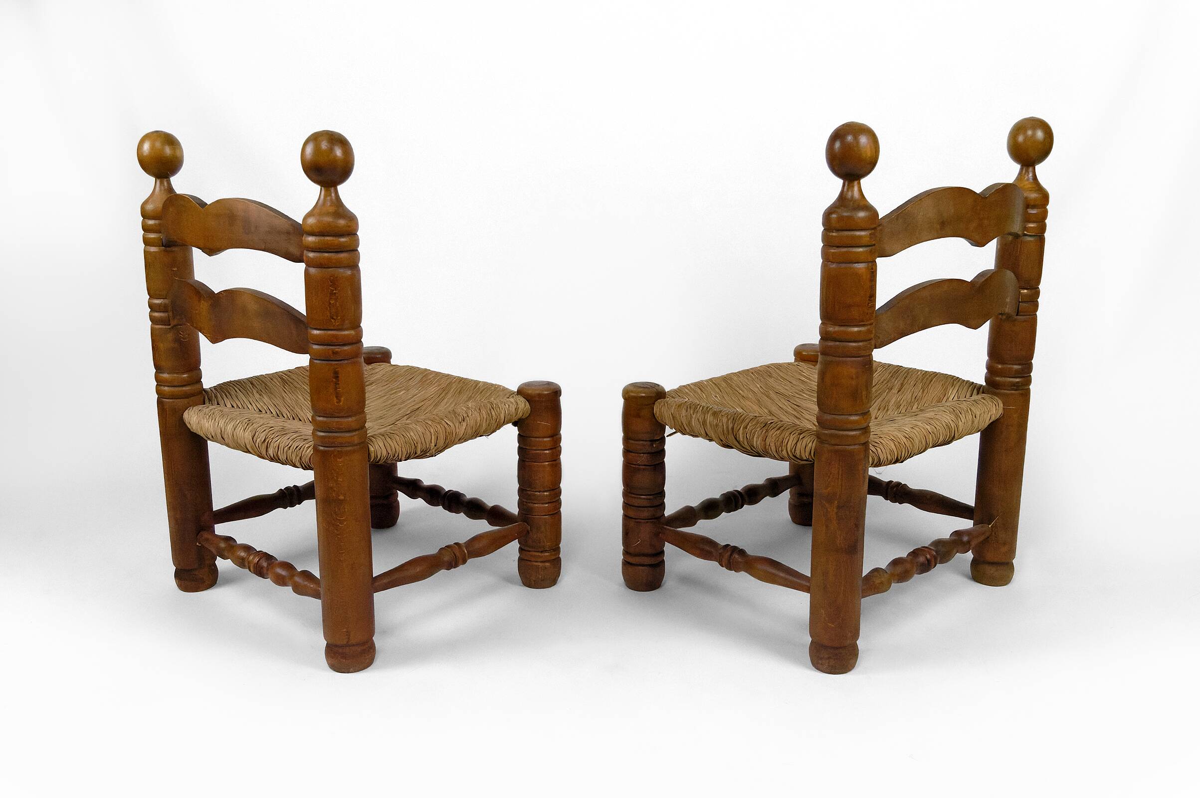 Pair of low straw chairs  circa 1940