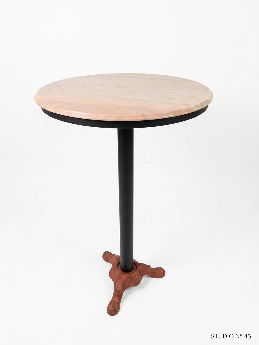 Bistro standing table with marble top and cast iron base.