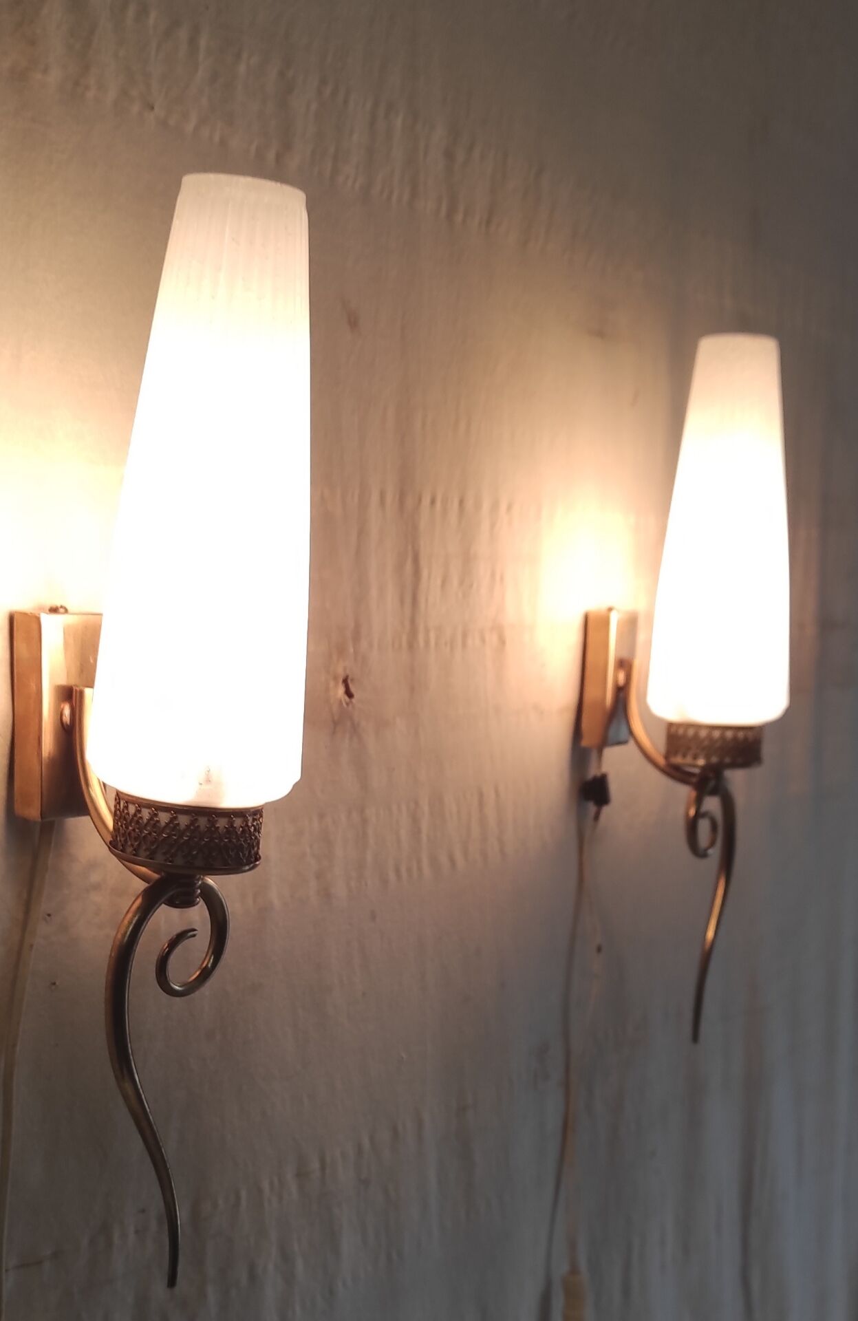 Modernist wall lights in brass and opaline - mid 20th century.