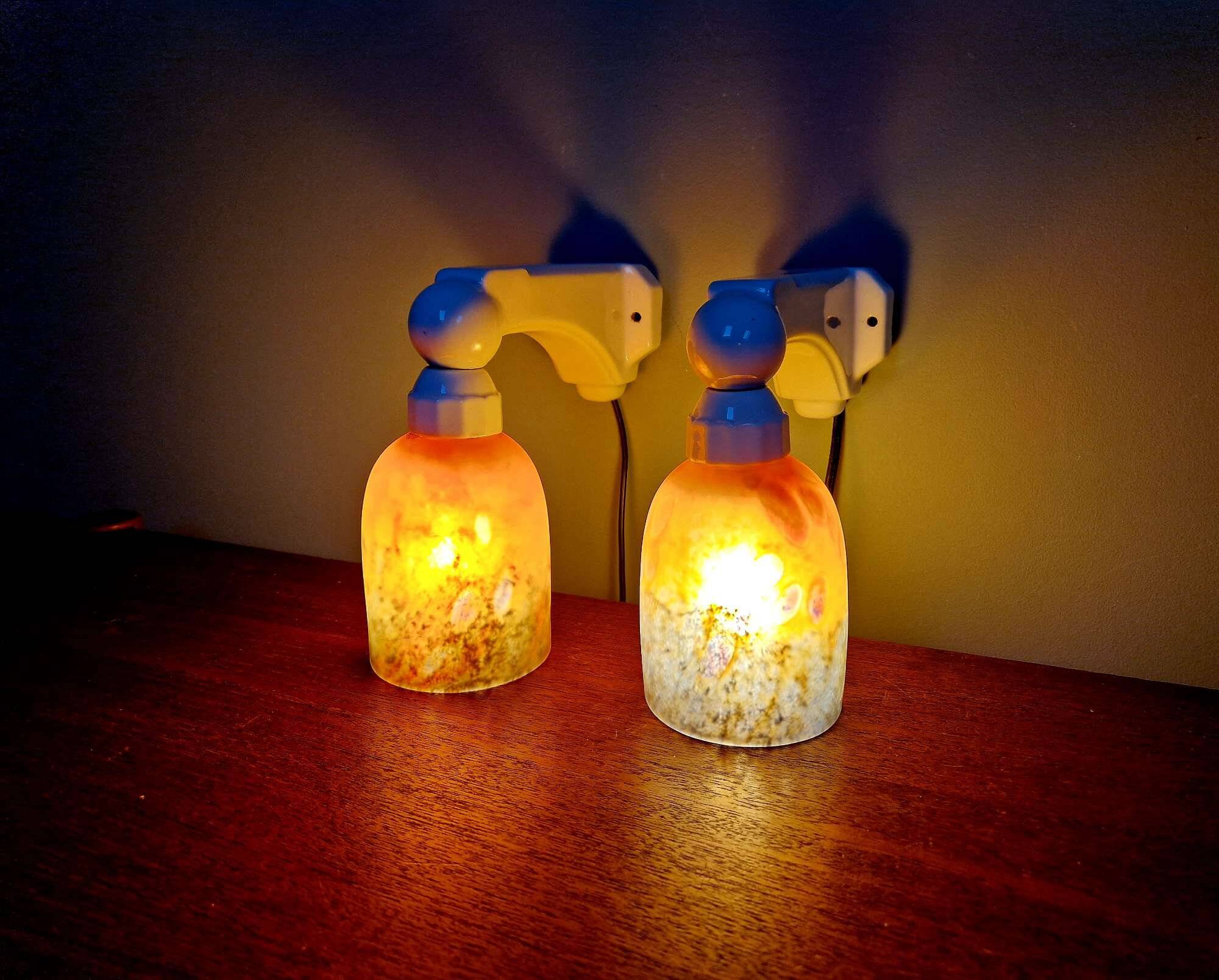 Pair of Art Deco wall sconces in multicoloured porcelain and frosted glass.