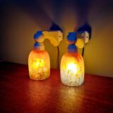 Pair of Art Deco wall sconces in multicoloured porcelain and frosted glass.