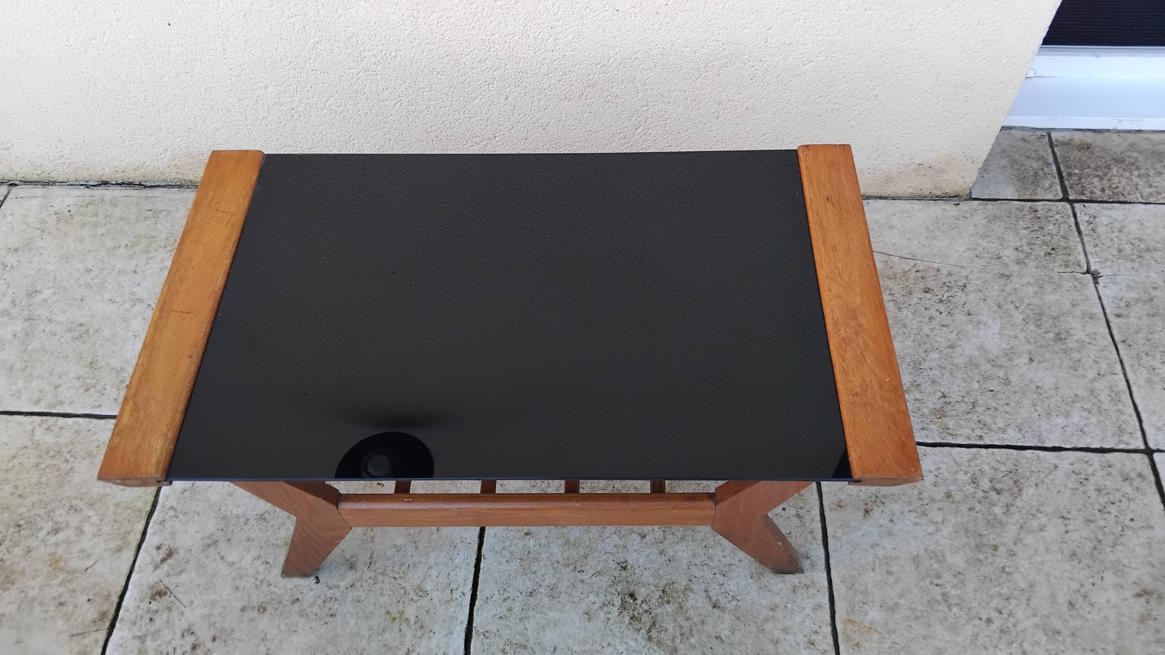 Vintage coffee table from the 1950s reconstruction, wood and glass.