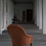 Victorian mahogany armchair, with wheels and coloured fabric, England, early 1900s.