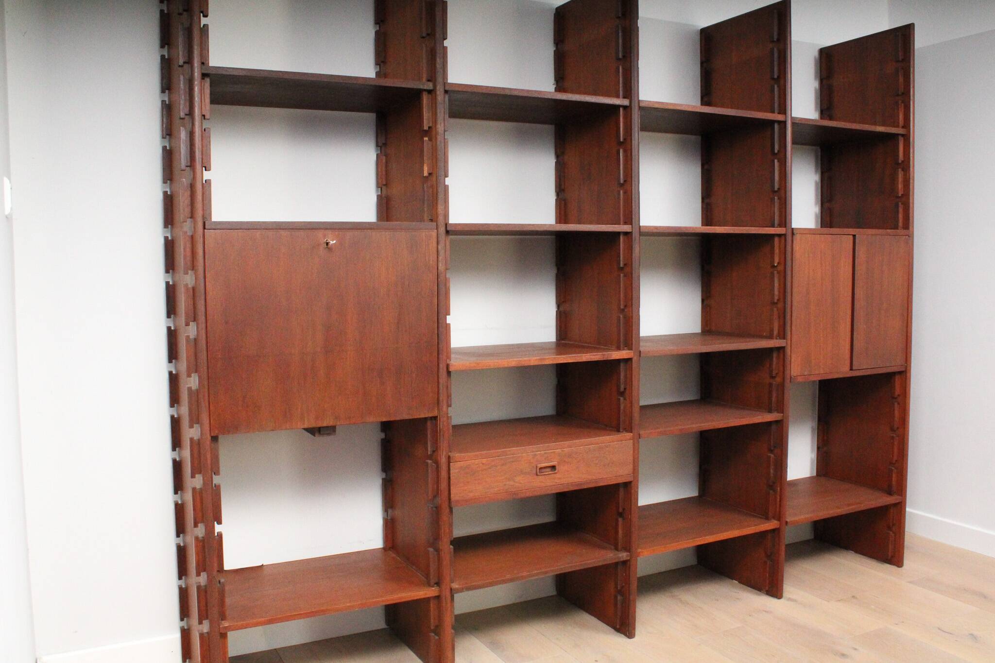 A vintage mid-century teak Gianfranco Frattini style bookcase room divider