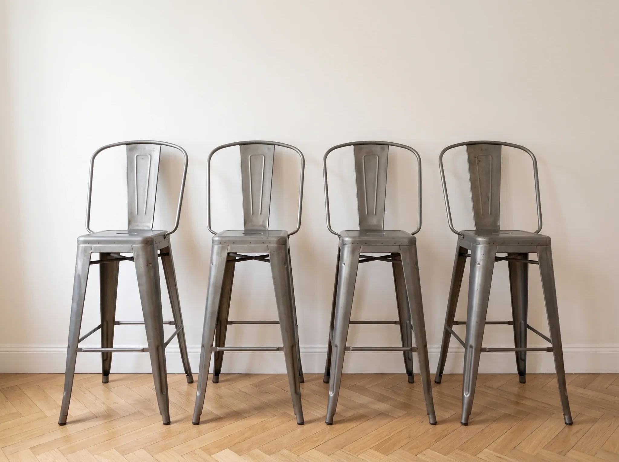 4 industrial grey metal Tolix bar stools
