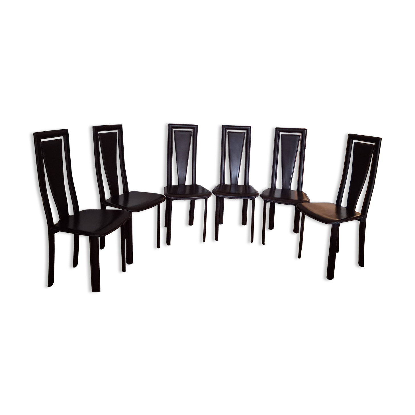 Set of 6 wooden chairs covered in leather.
