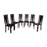Set of 6 wooden chairs covered in leather.