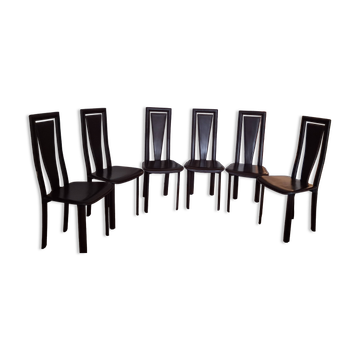 6 wooden chairs covered in leather