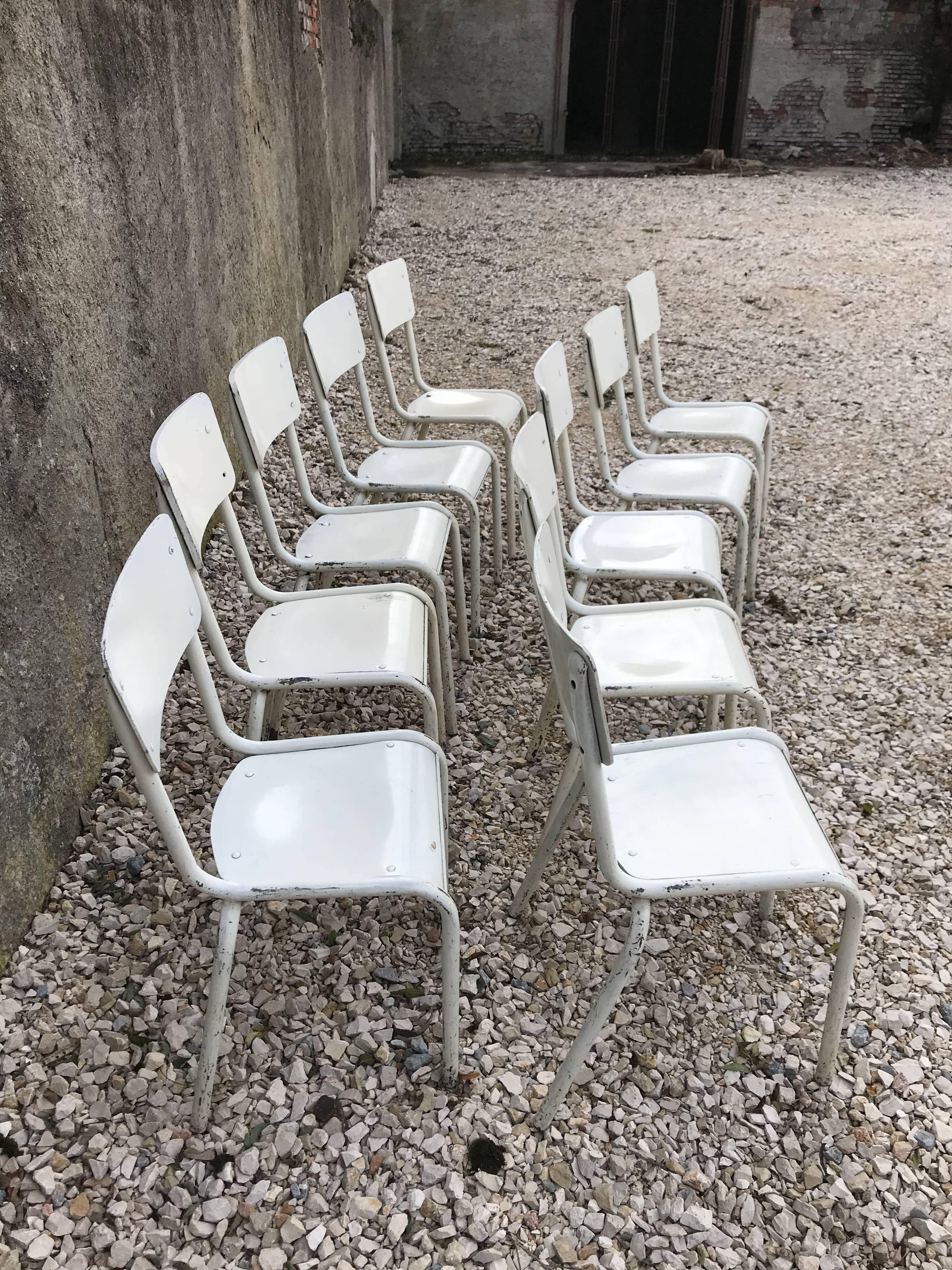 10 white school chairs