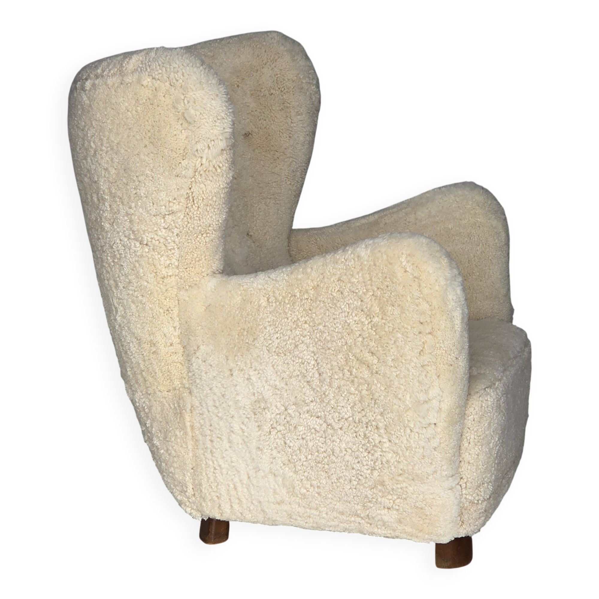 1960s, Danish armchair, genuine sheepskin "Canberra", reupholstered.