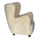 Fauteuil danois des années 1960, en véritable peau de mouton "Canberra", retapissé.
