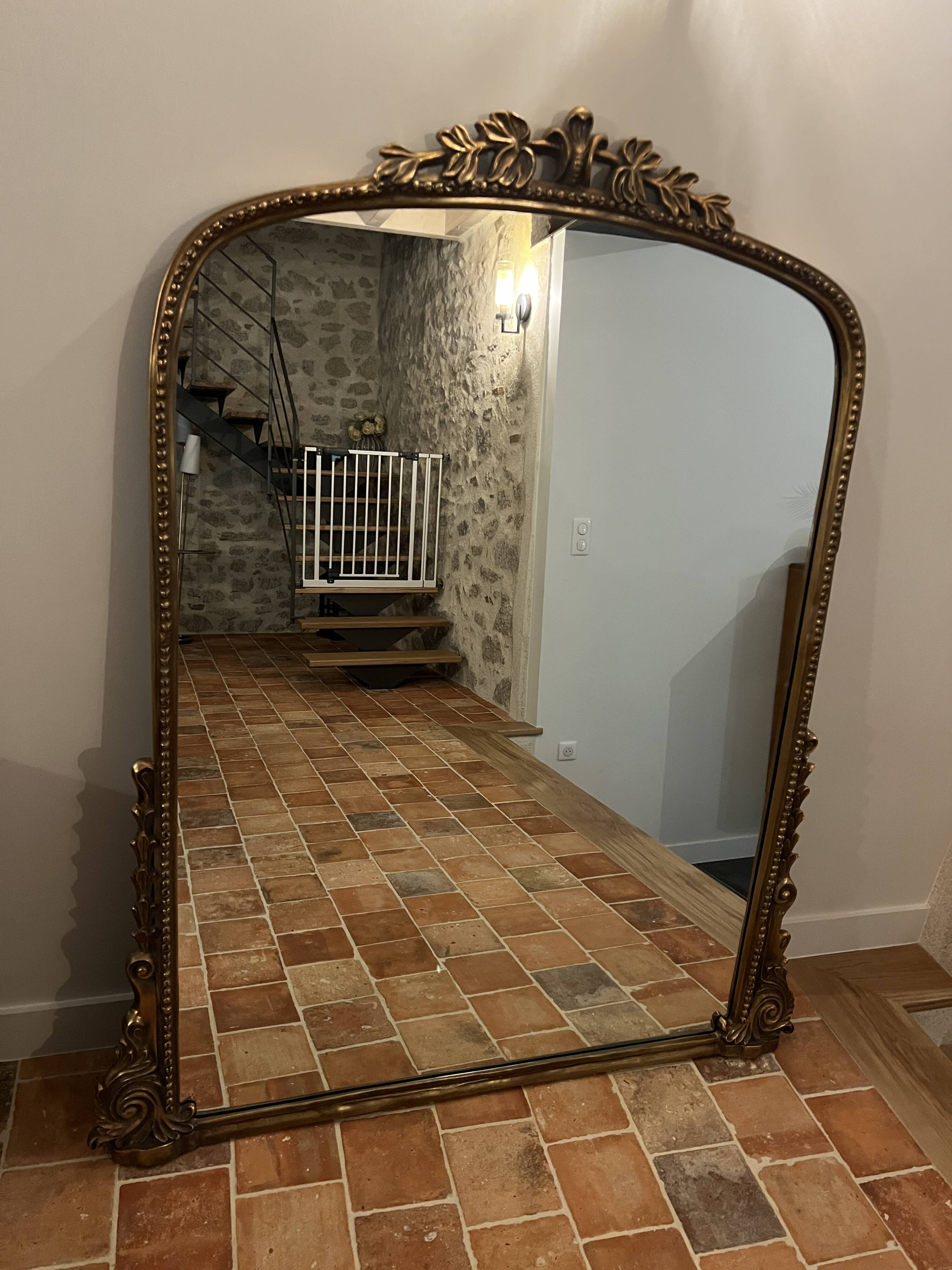 Large gilded mirror with pediment