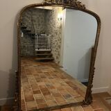Large gilded mirror with pediment