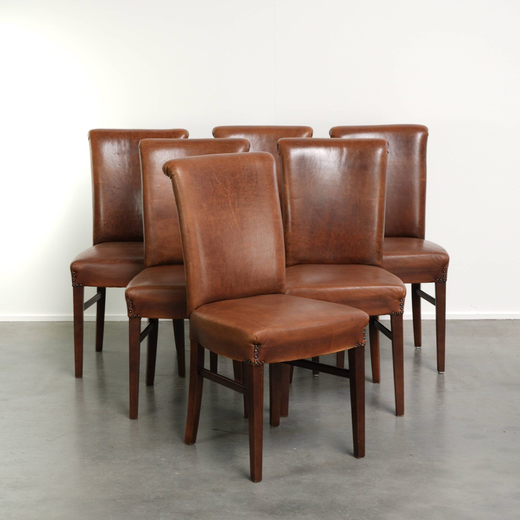 Set of 6 sheepskin dining chairs in a cognac colour with a lovely patina