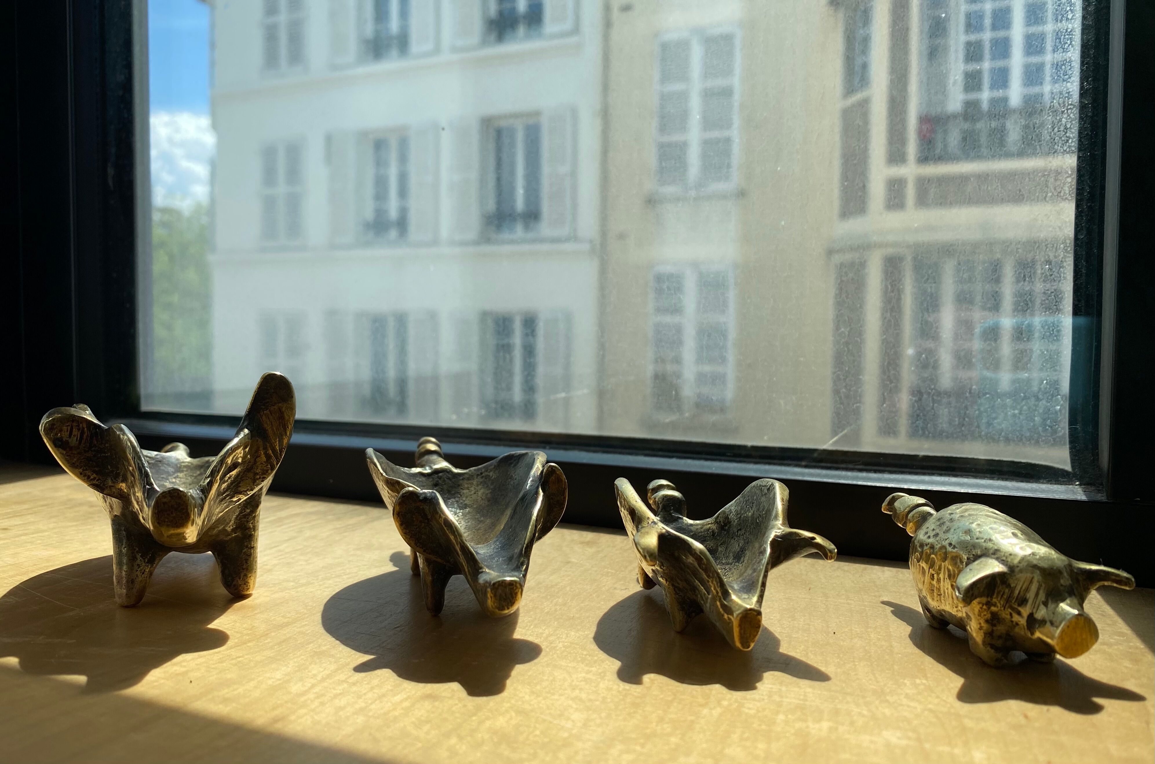 4 Pfizer bronze ashtray pigs