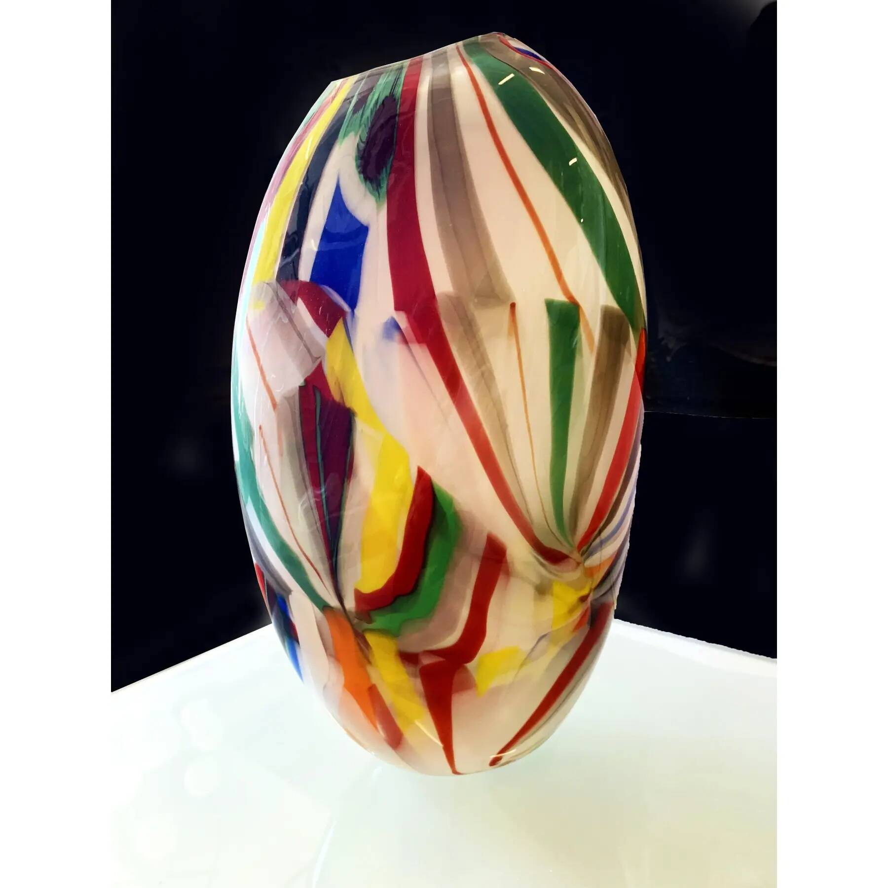 Abstract vase in milky-white Murano-inspired glass with multicoloured reeds.