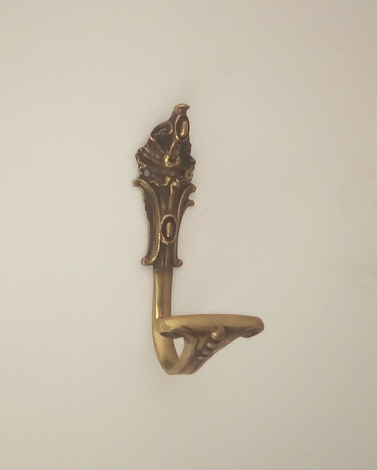 Old brass coat rack hook
